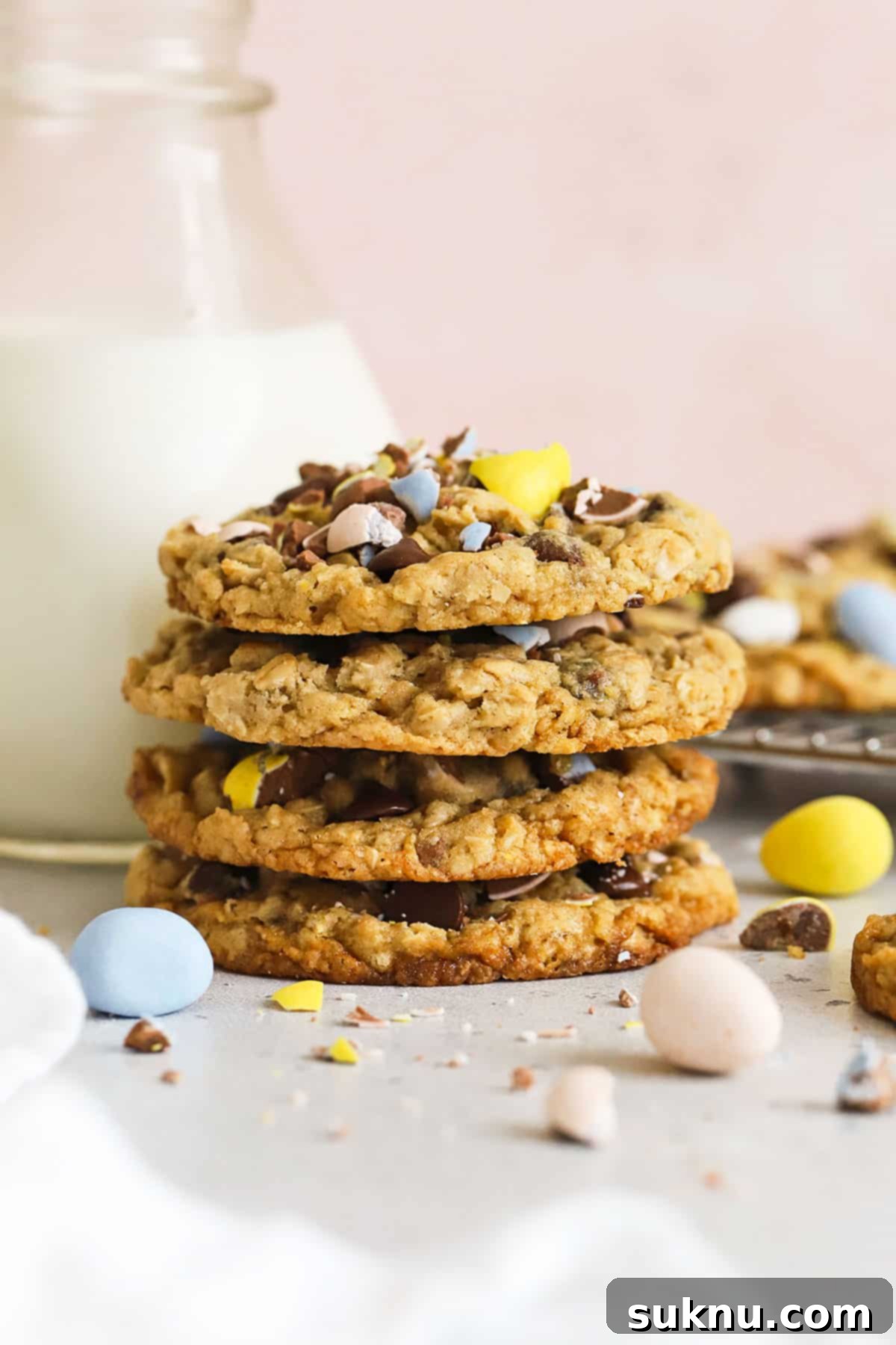 Irresistible Gluten-Free Cadbury Egg Cookies 8 gluten-free cadbury mini egg cookies in a stack with a bottle of milk, ready for a delicious snack