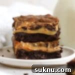 gluten-free dulce de leche brownies stacked on a white plate