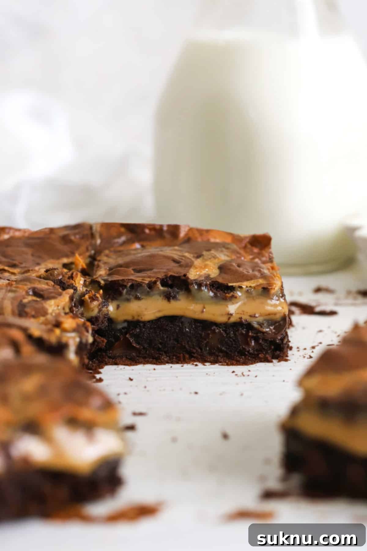 Close-up of a gluten-free brownie with dulce de leche filling, showing the gooey caramel layer.