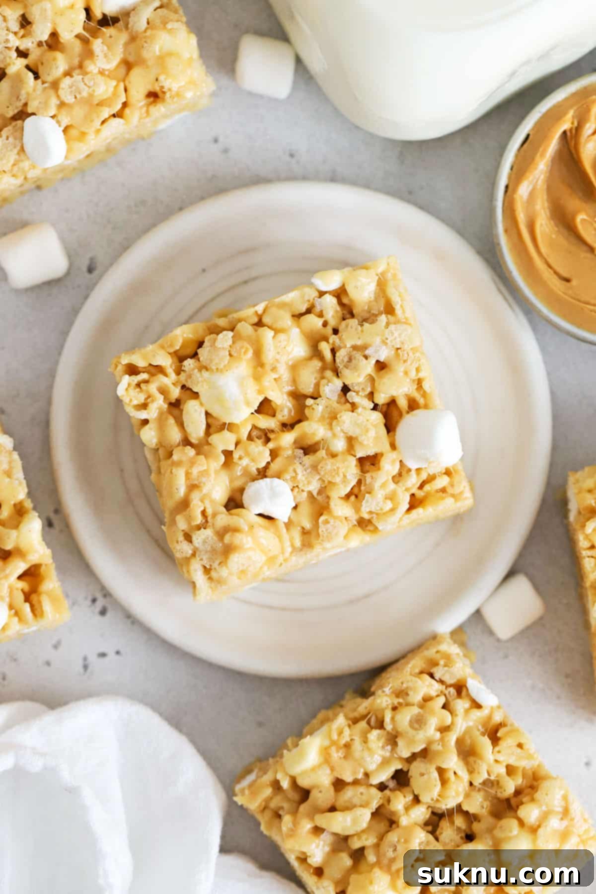Gluten-free peanut butter rice krispie treats cut into perfect squares, ready to serve