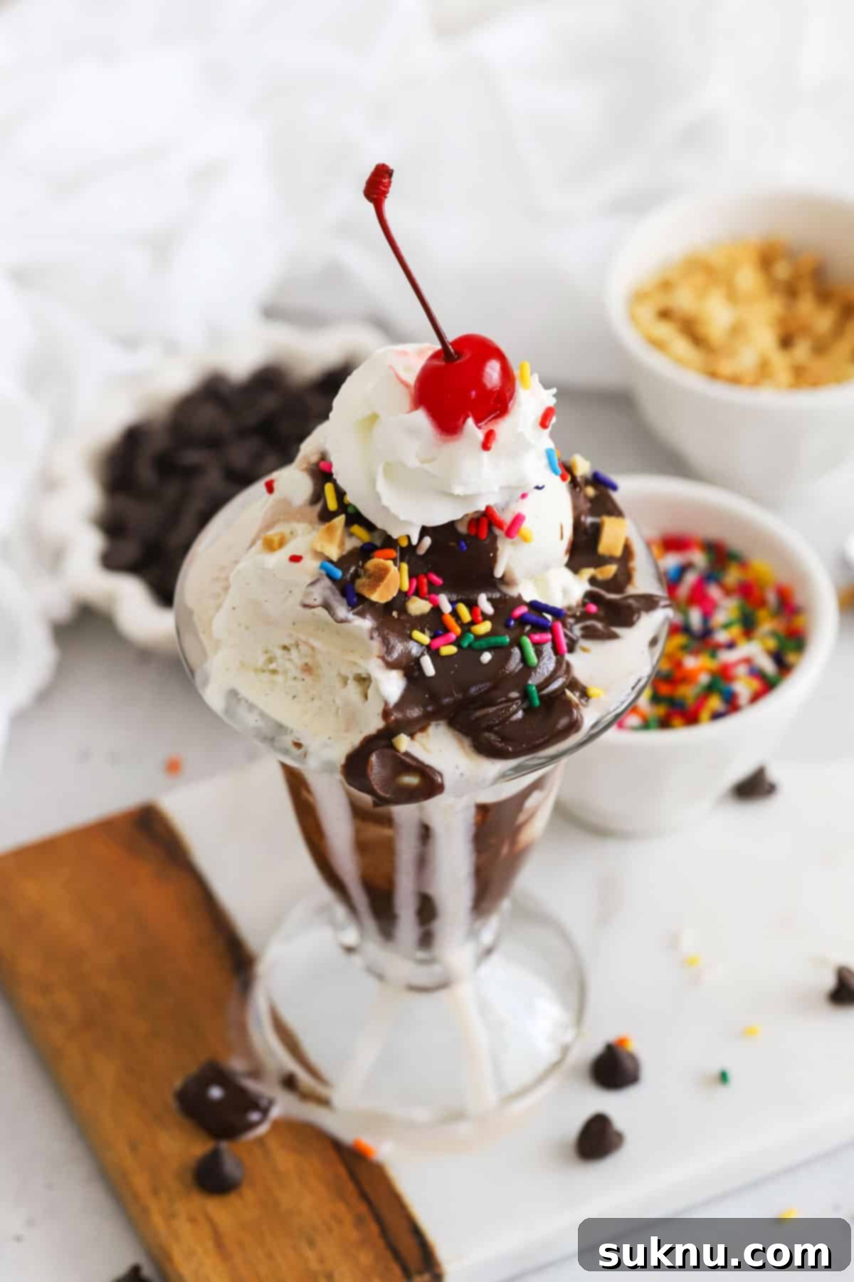 Decadent Hot Fudge Sundae 5 Classic ice cream sundae with homemade hot fudge sauce, whipped cream, sprinkles, nuts, and a maraschino cherry
