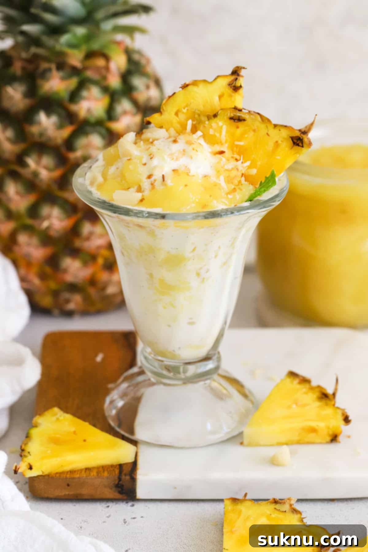 Vanilla ice cream topped with homemade pineapple sauce, toasted coconut, macadamia nuts, and fresh pineapple