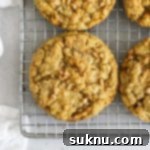 Chewy Gluten-Free Toffee Oatmeal Cookies 10 Golden brown oatmeal toffee cookies cooling on a wire rack