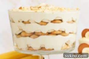 layered gluten-free banana pudding in a large glass trifle dish