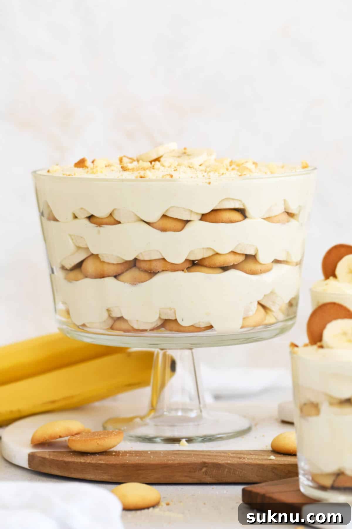 layered gluten-free banana pudding in a large glass trifle dish