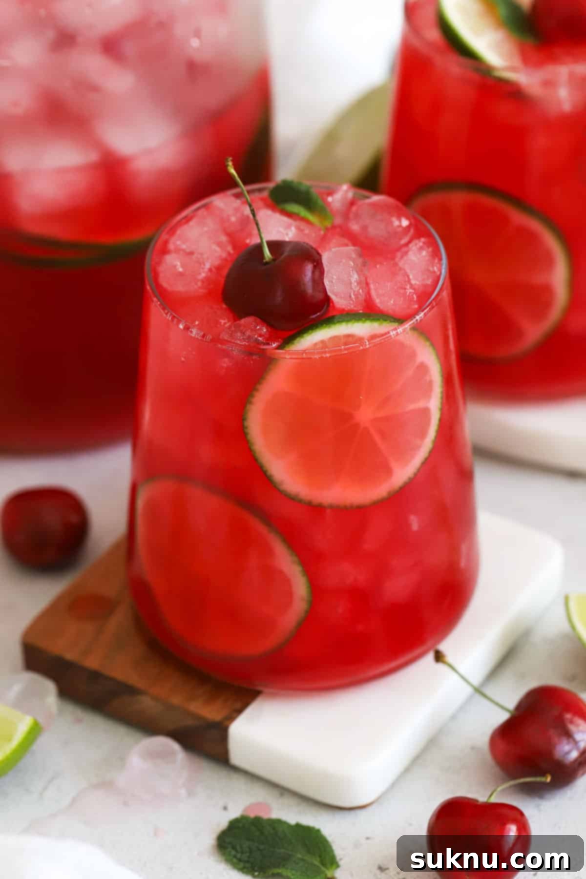 Several glasses of homemade cherry limeade ready to be served
