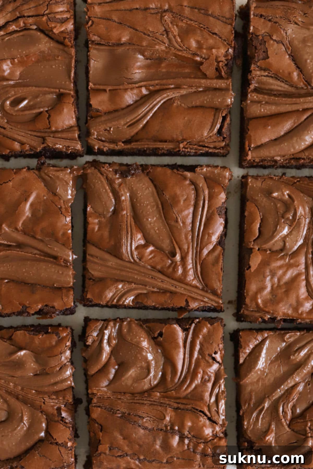 Fudgy Gluten-Free Nutella Brownies cut into perfect squares, showcasing their rich chocolate and hazelnut swirl