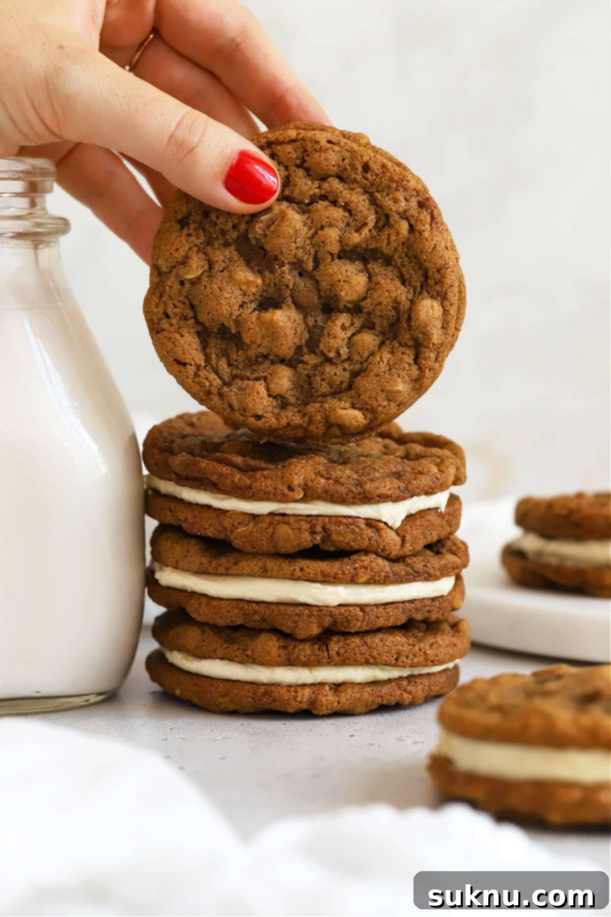 Stack of homemade gluten-free oatmeal cream pies, invitingly soft and creamy