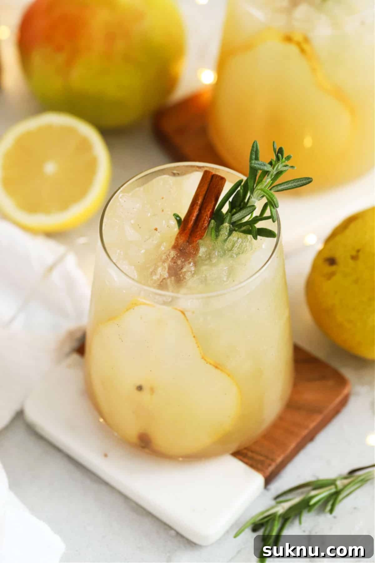 Crisp Pear Ginger Fizz 6 Fresh pear punch with slices of pear, cinnamon sticks, and fresh rosemary