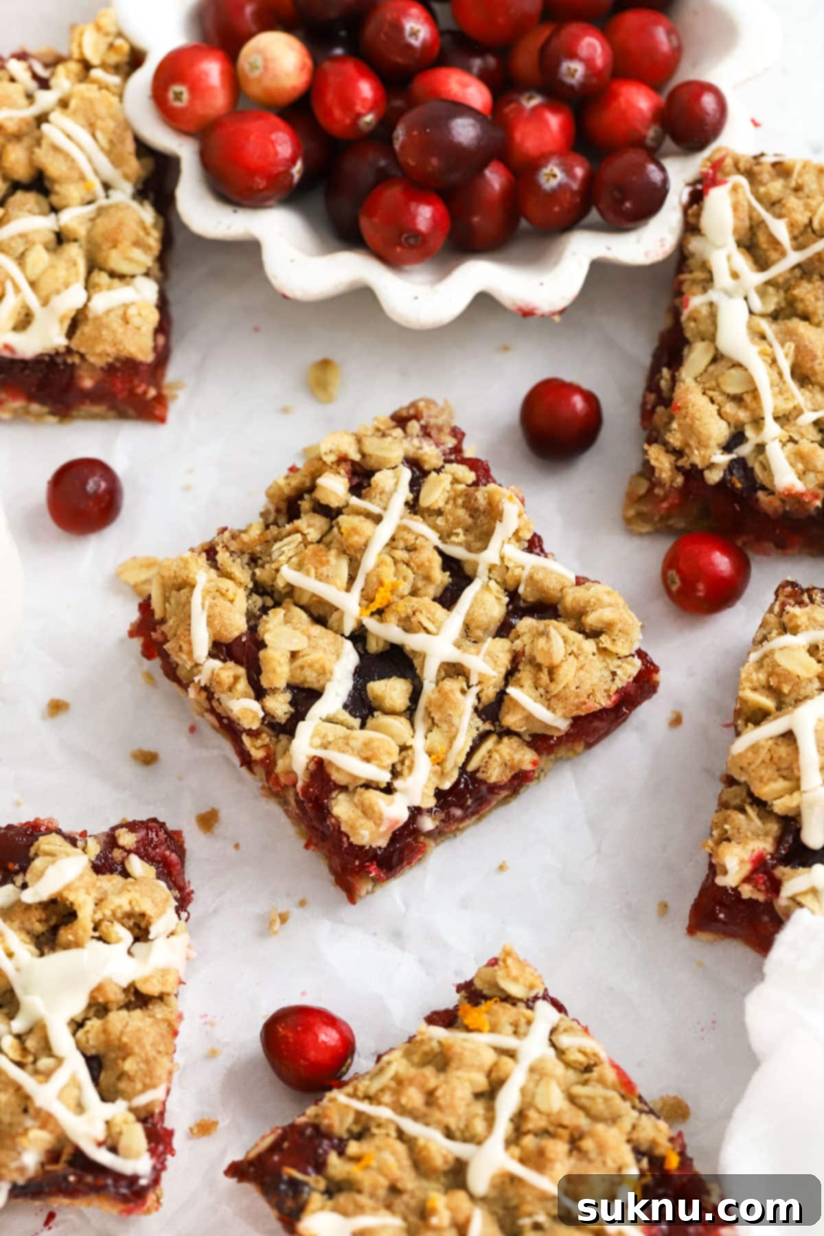 Gluten-free cranberry crumble bars, perfectly cut into squares, ready to be enjoyed.