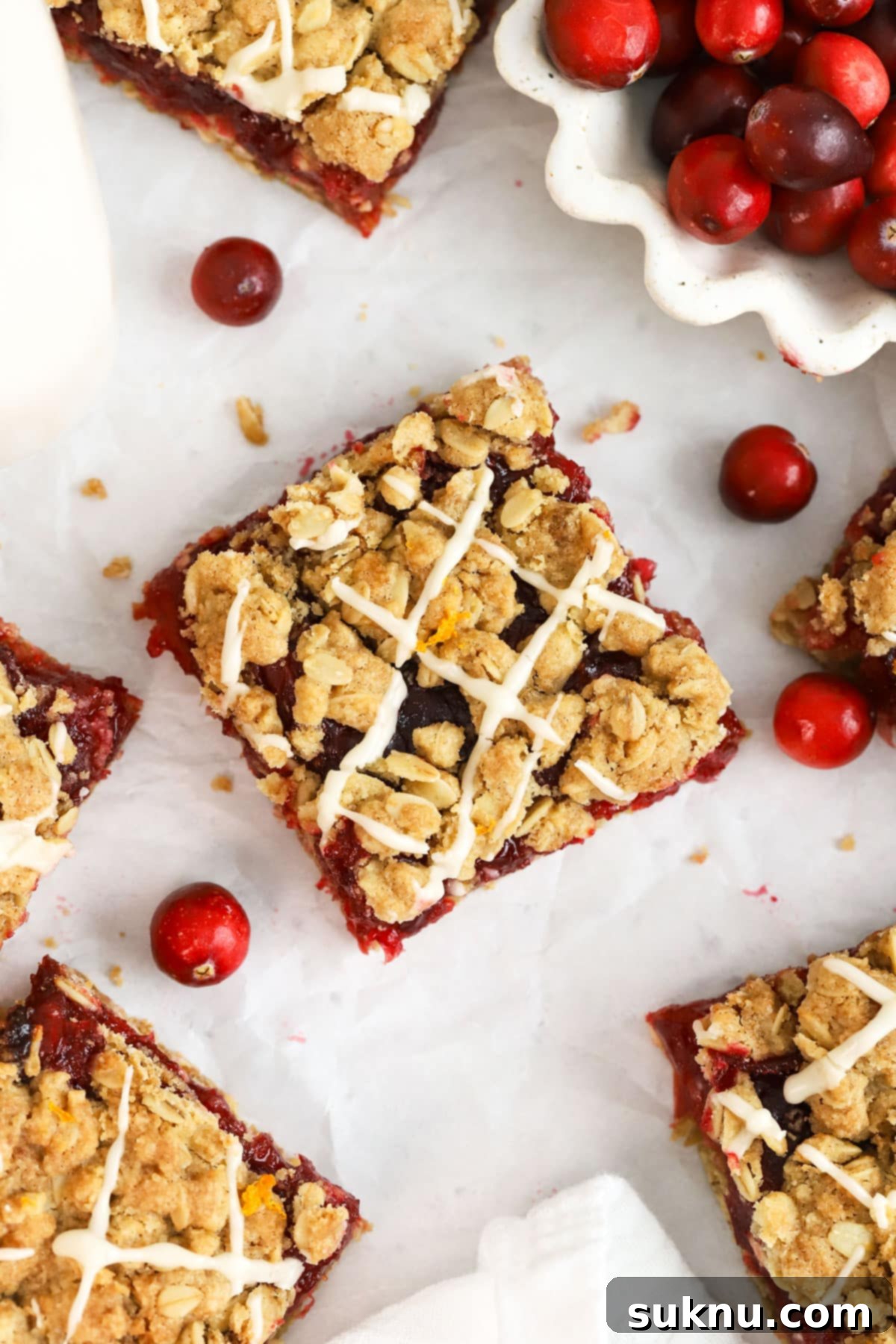 Gluten-free cranberry crumble bars, expertly cut into perfect squares, showcasing their delicious layers.