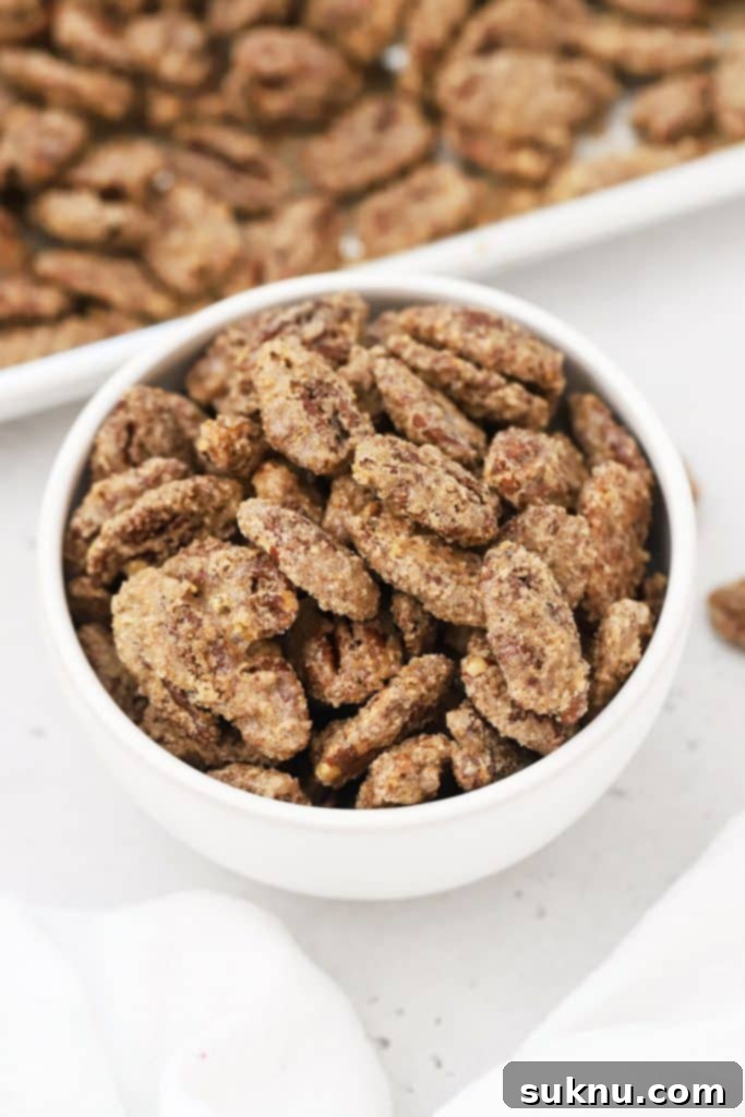 a white bowl of cinnamon sugar pecans