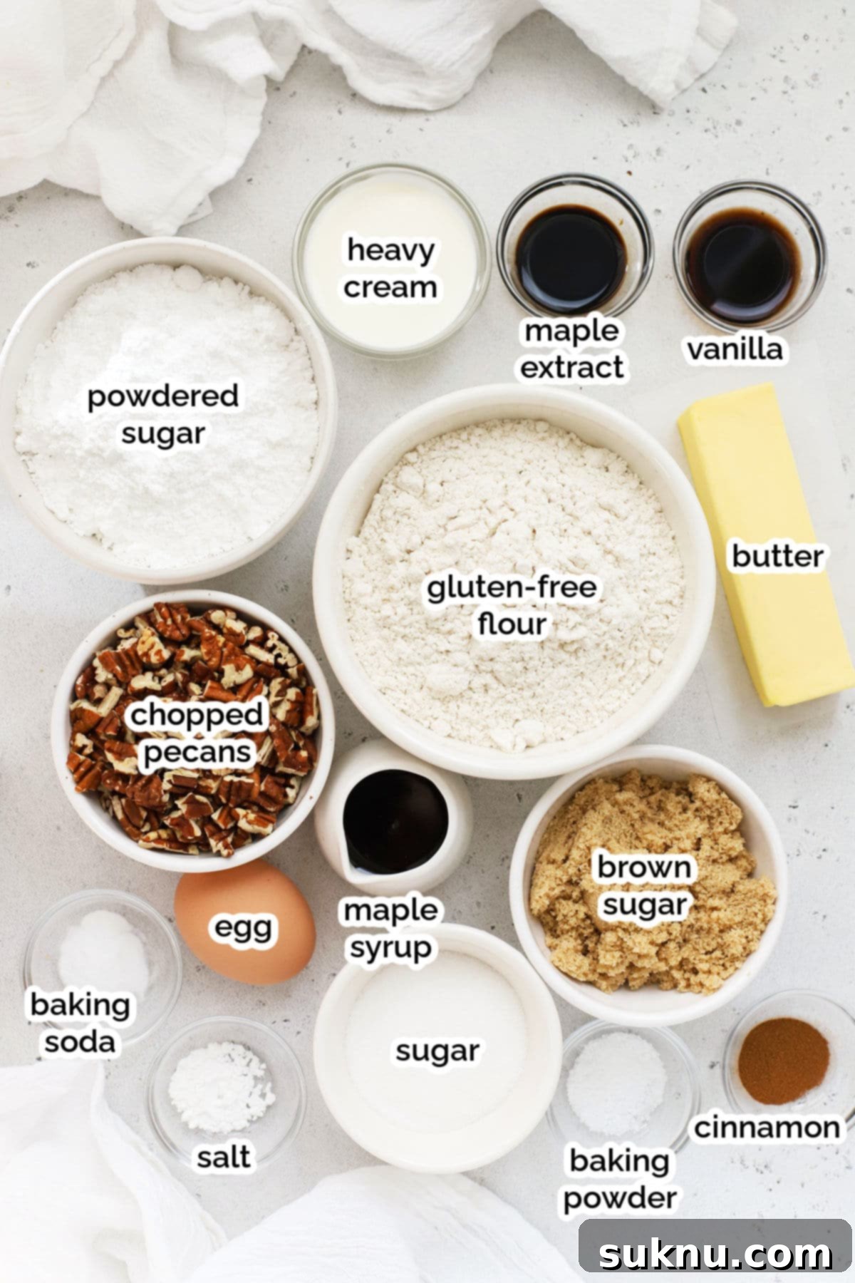 Ingredients for gluten-free maple pecan cookies laid out on a surface