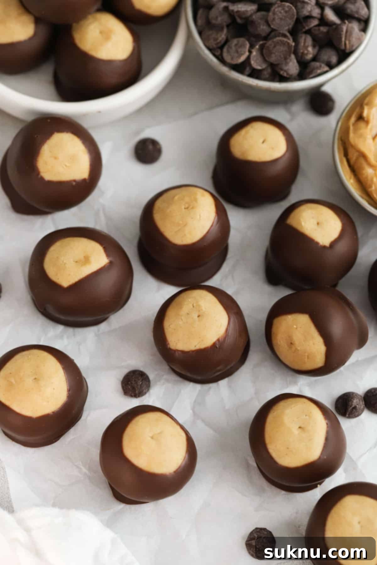 chocolate peanut butter buckeye candy on a piece of parchment
