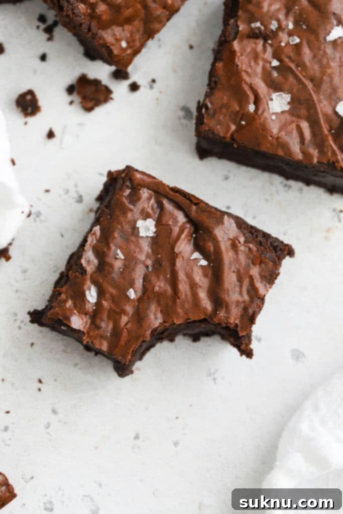 Close up overhead view of fudgy gluten-free brown butter brownies cut in squares