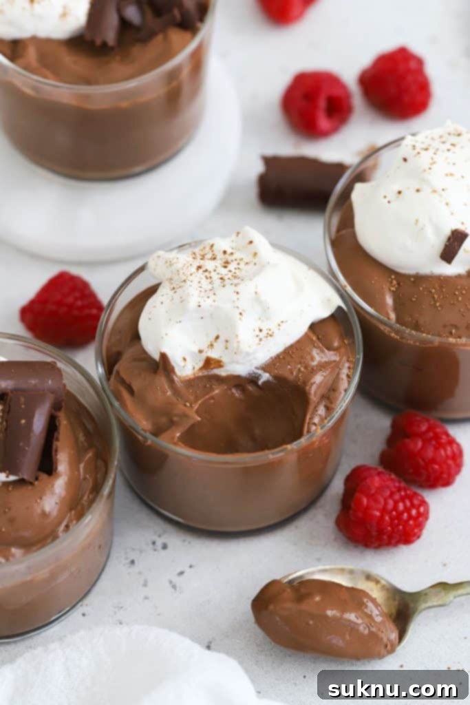 homemade gluten-free chocolate pudding topped with whipped cream