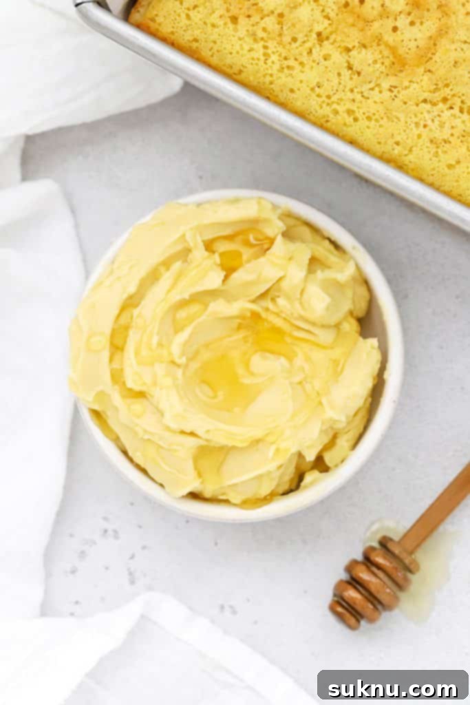 Overhead view of whipped honey butter in a white bowl