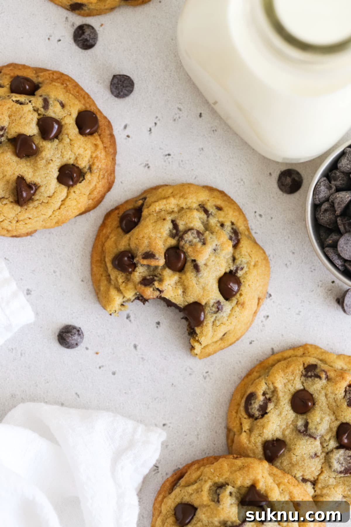 gluten-free pudding mix chocolate chip cookies next to a bottle of milk