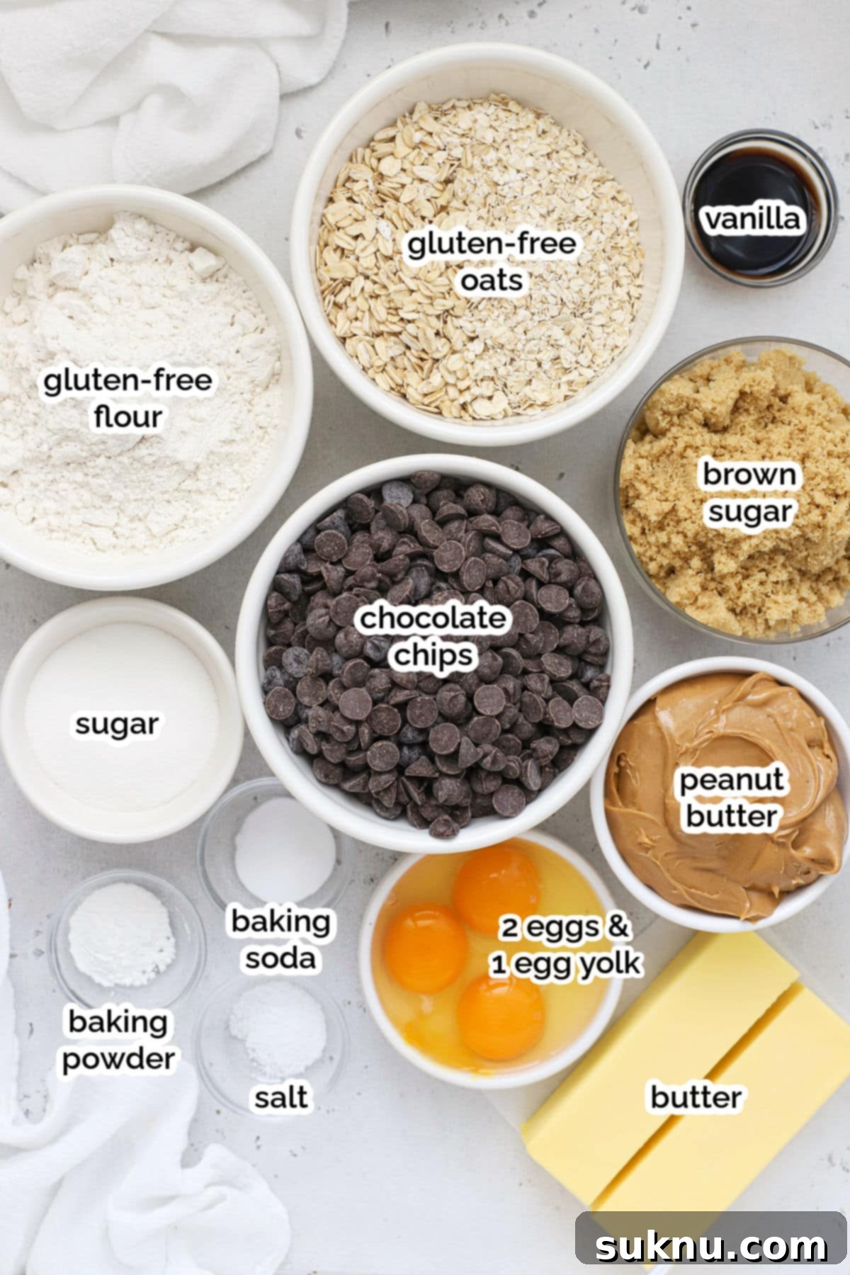 Gluten-Free Peanut Butter Oatmeal Chocolate Chip Delights 3 A selection of ingredients for gluten-free peanut butter oatmeal chocolate chip cookies, arranged artfully on a light background.