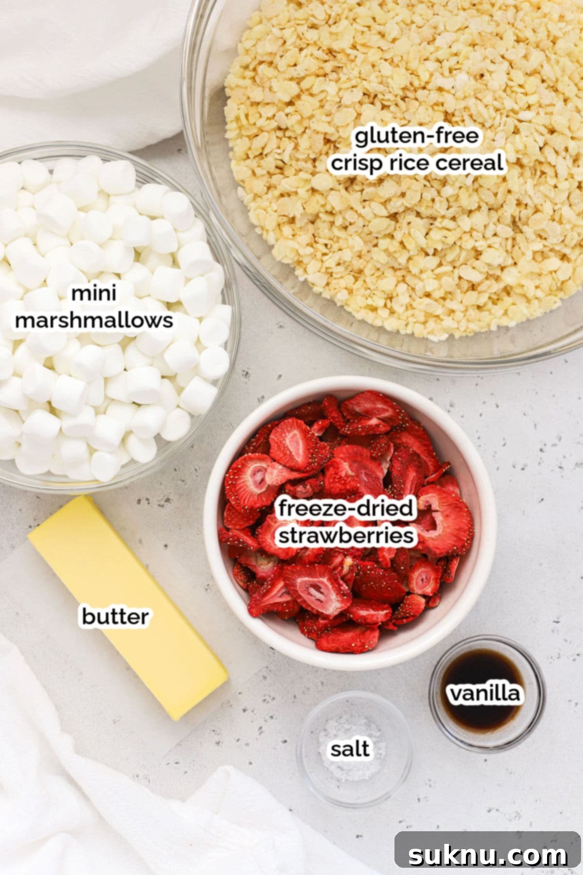 ingredients for gluten-free strawberry rice krispie treats laid out on a table