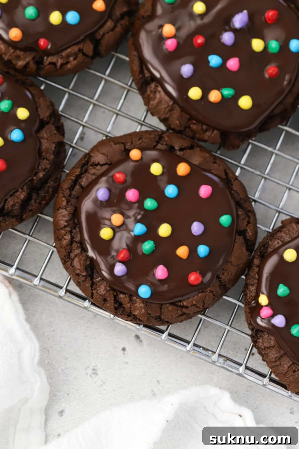 Gluten-free cosmic brownie cookies with chocolate ganache and rainbow sprinkles