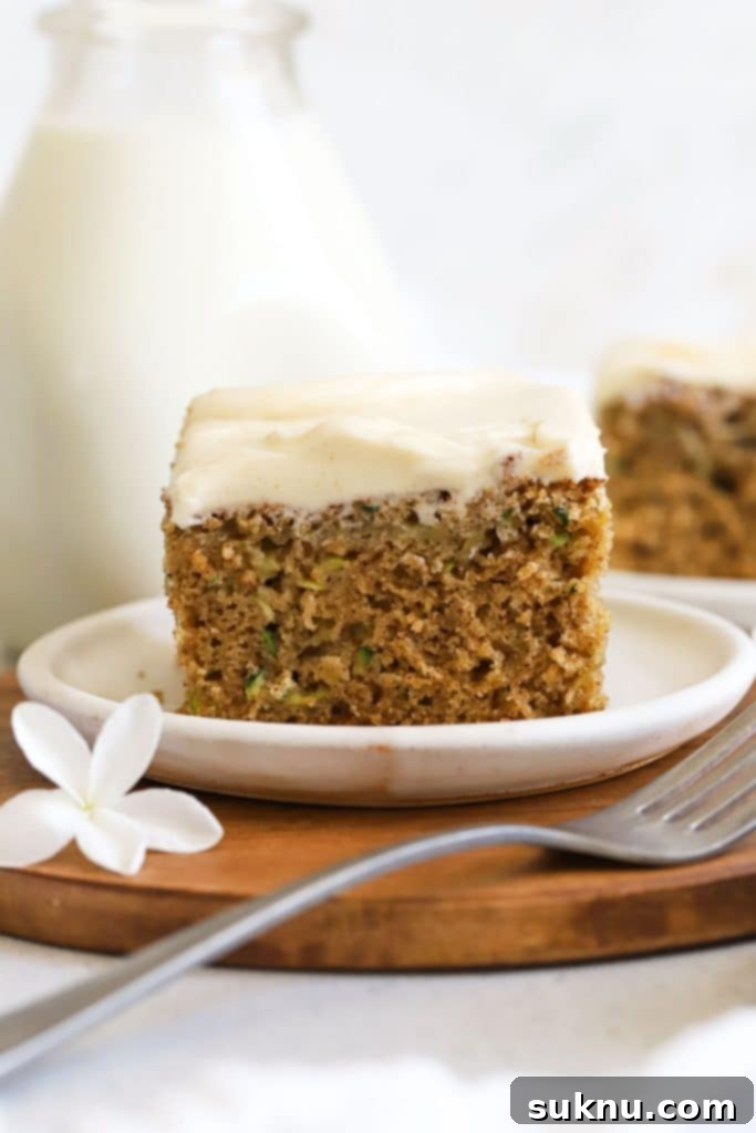slices of gluten-free zucchini cake on white dessert plate