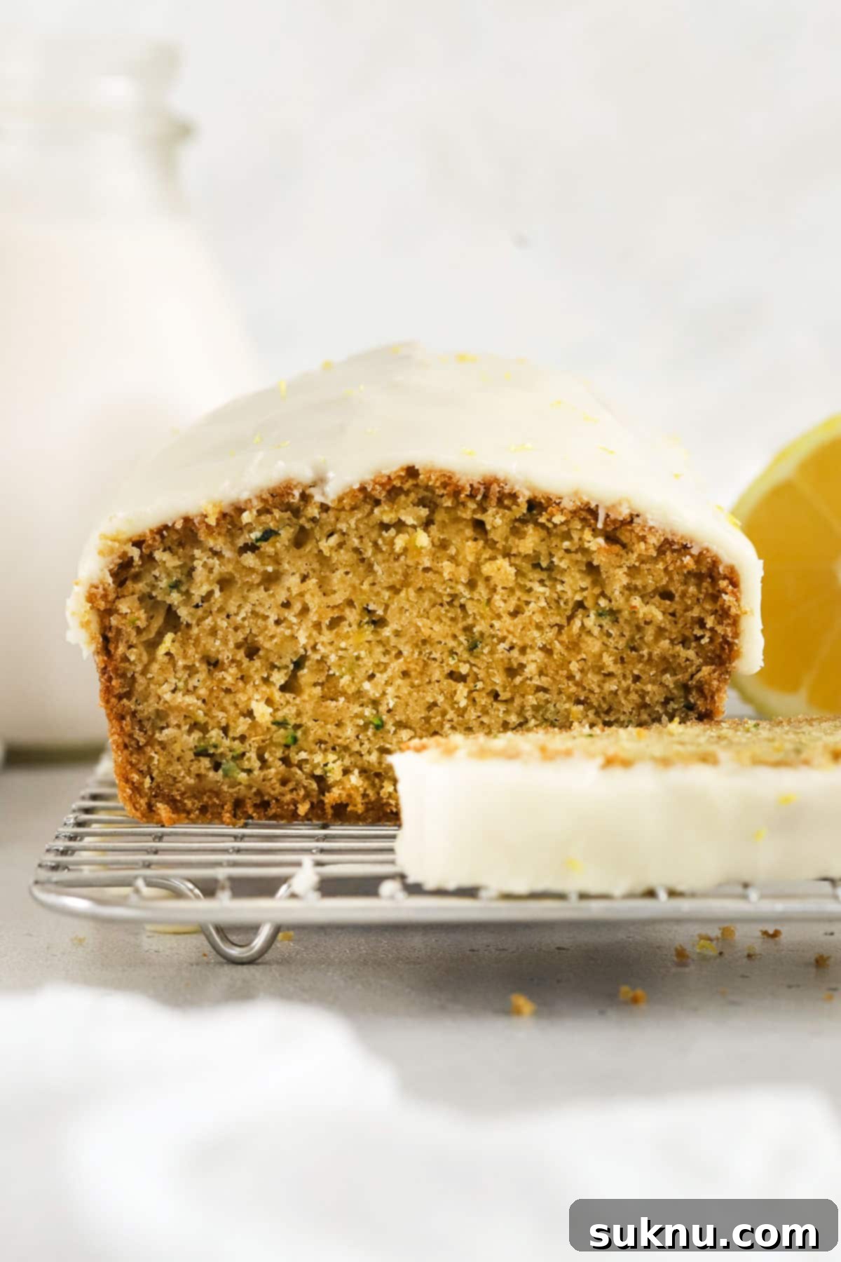 gluten-free lemon zucchini loaf cake with lemon glaze