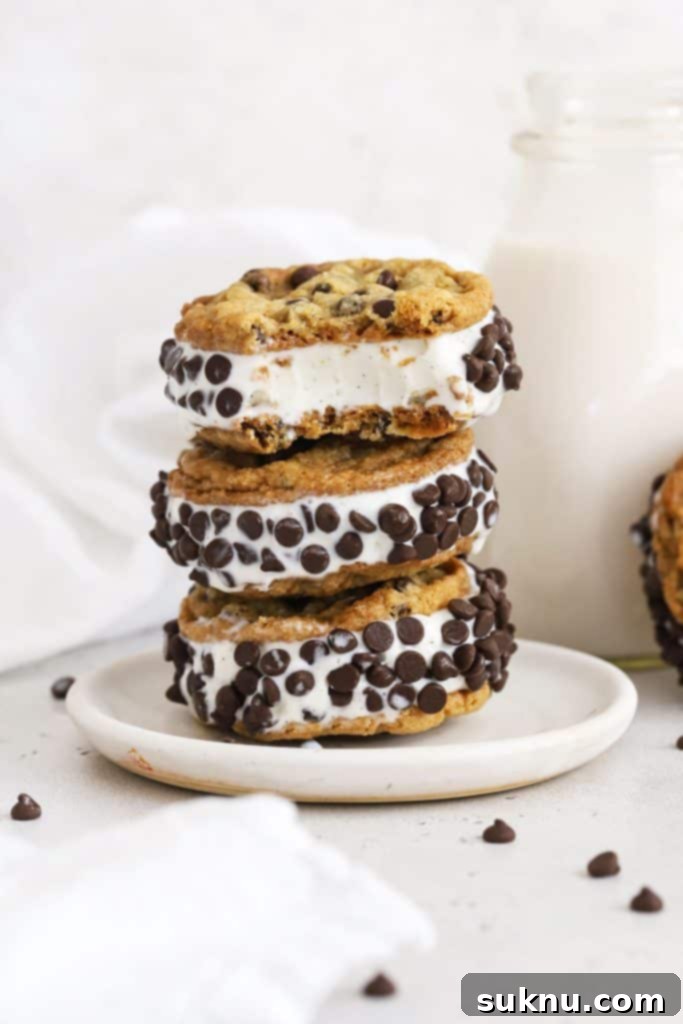 Gluten-free cookie ice cream sandwiches stacked on a white plate