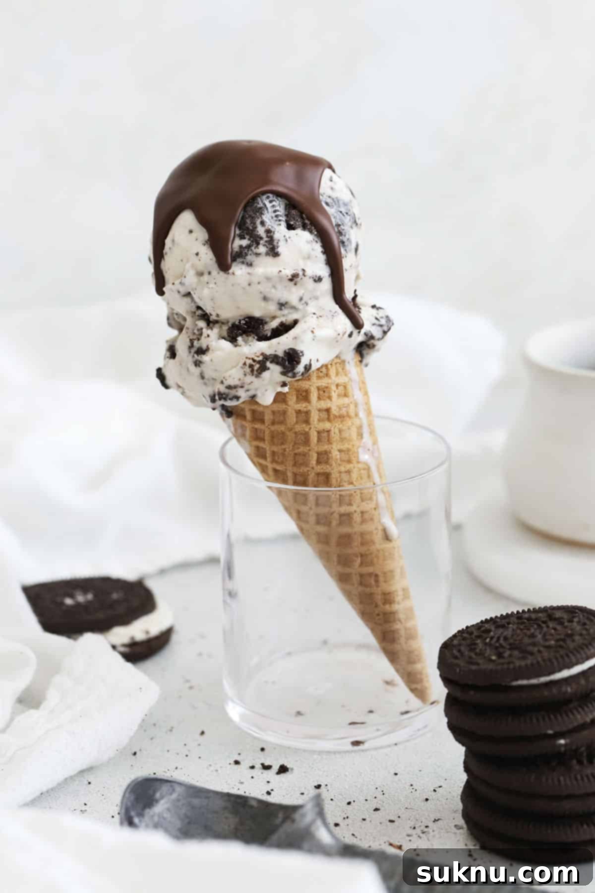 A gluten-free Oreo ice cream cone drizzled with magic chocolate shell