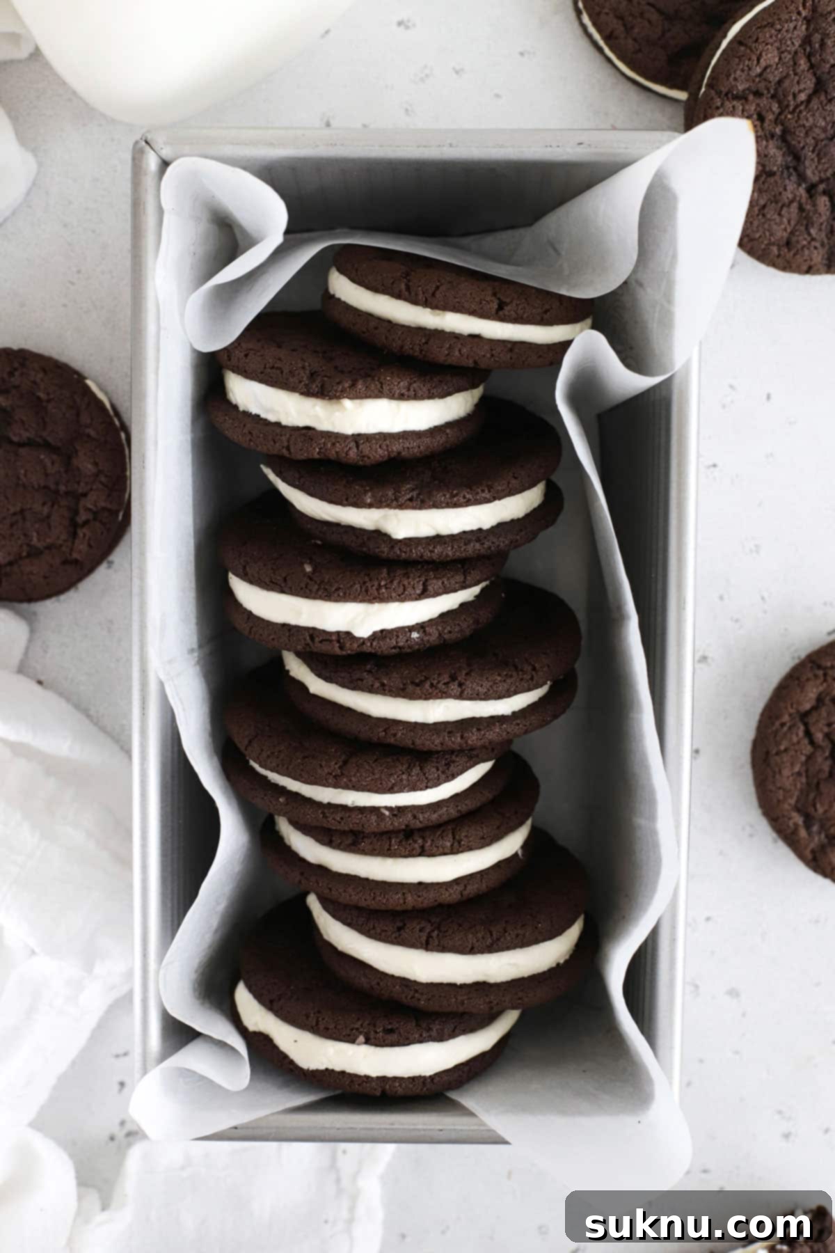 Homemade gluten-free Oreo cookies beautifully arranged in a rustic loaf pan