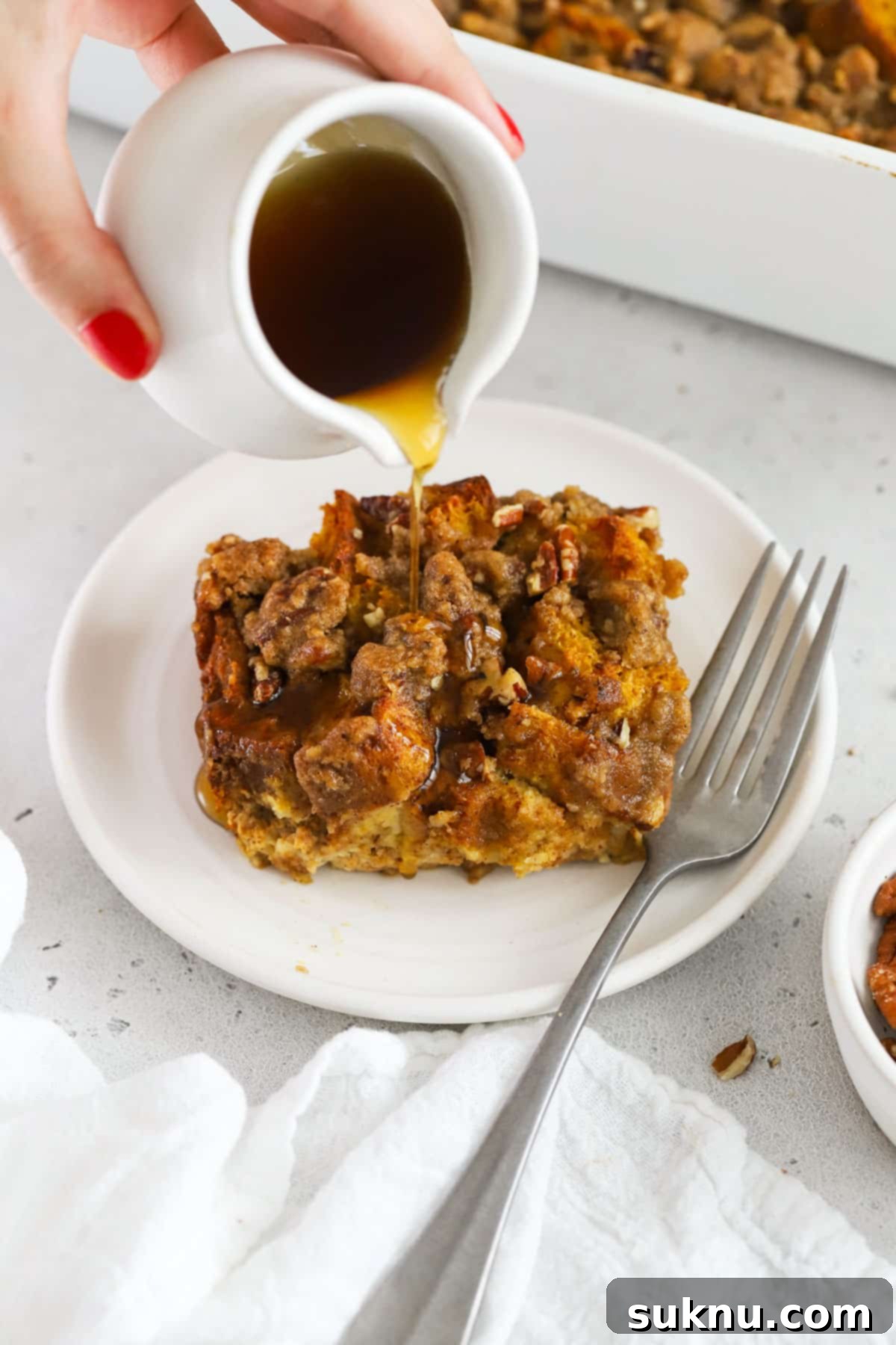 Gluten-Free Pumpkin Spice French Toast Casserole 2 Delicious gluten-free pumpkin French toast casserole being drizzled with maple syrup