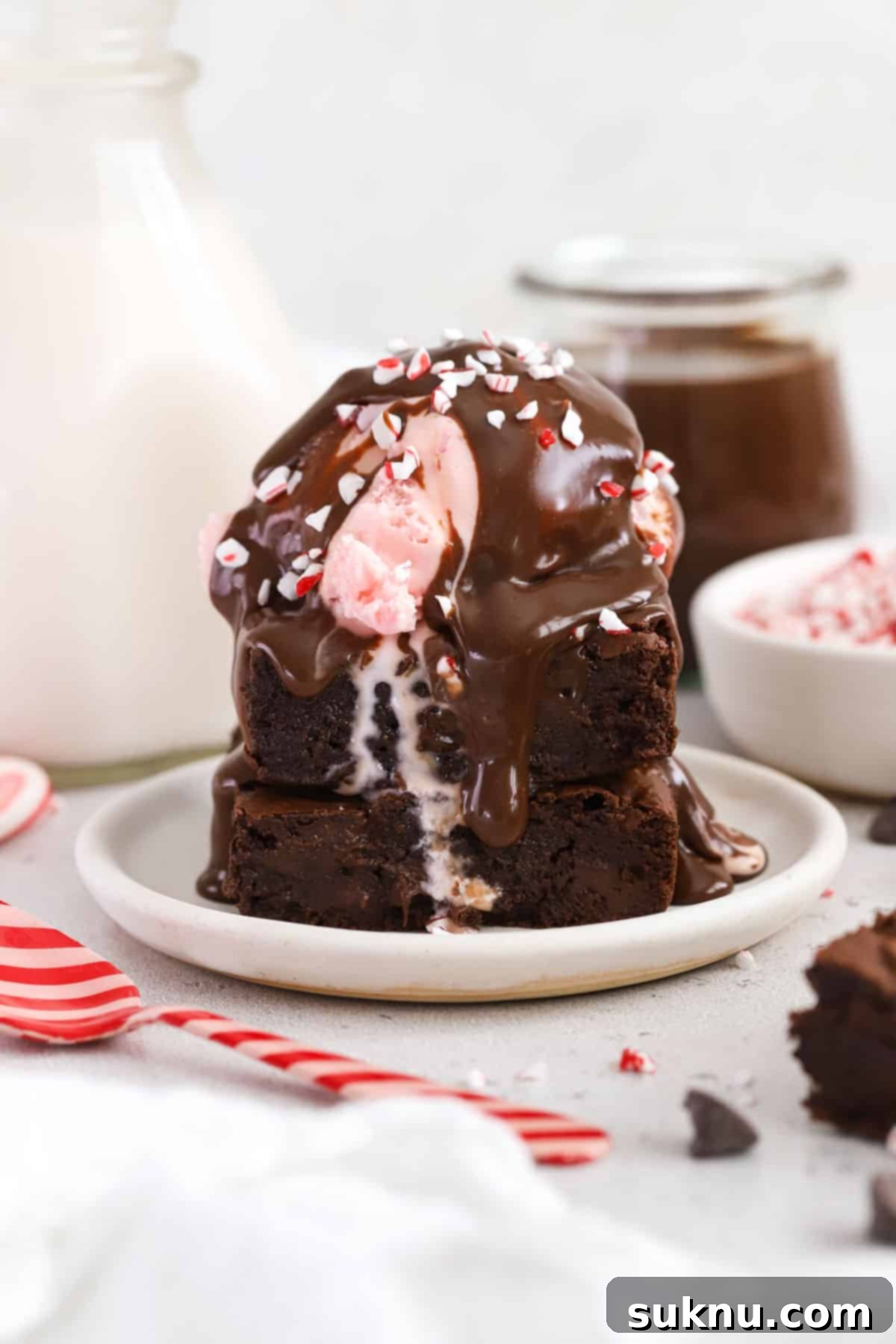 Peppermint hot fudge sauce on a peppermint brownie sundae