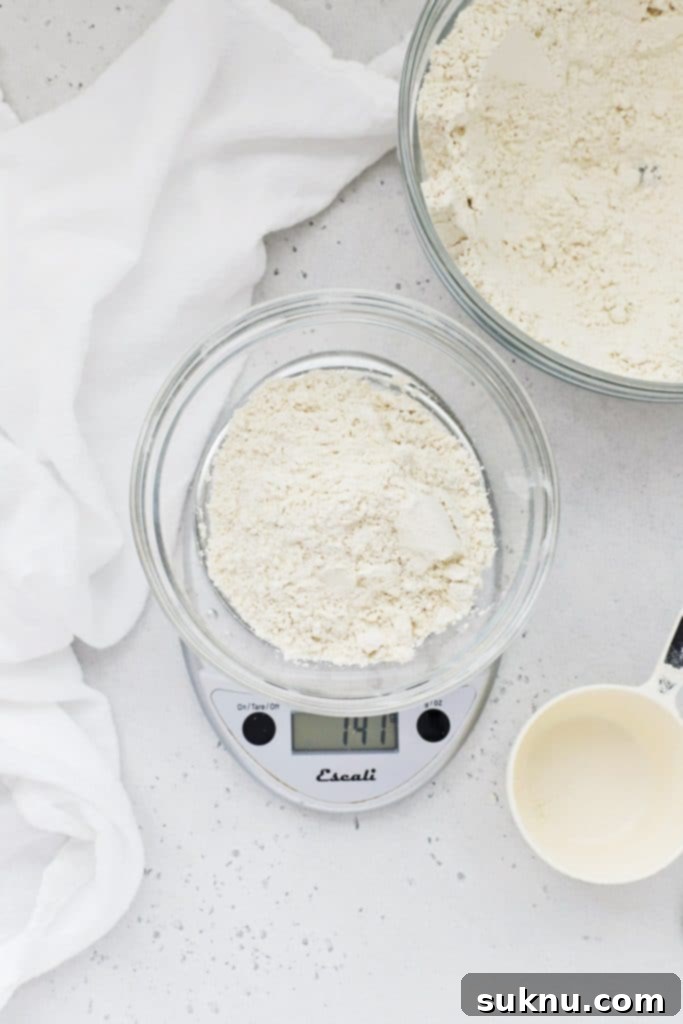 Master Flour Measurement For Perfect Baking 13 Kitchen scale showing an inflated weight after incorrect flour measurement by direct scooping