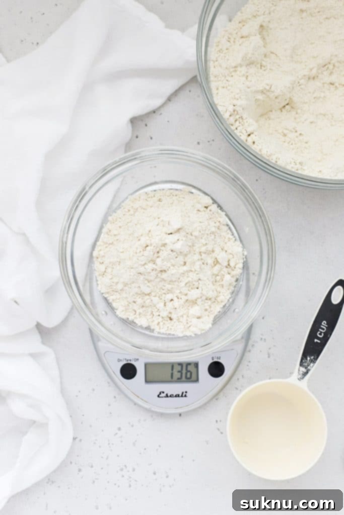 Master Flour Measurement For Perfect Baking 15 Kitchen scale showing the weight of unlevelled flour, still too high
