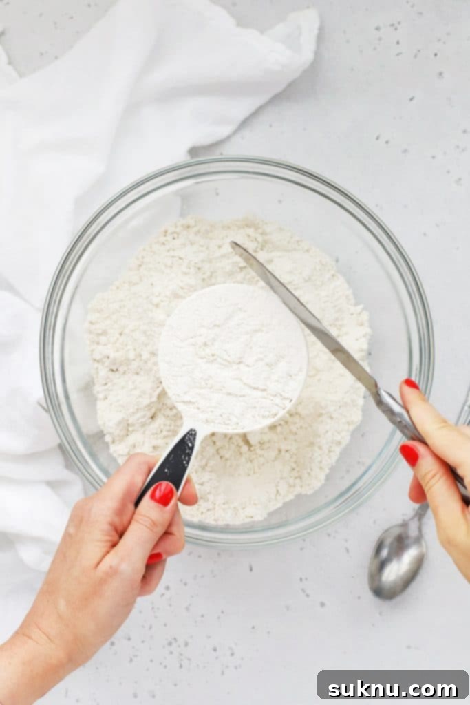 Master Flour Measurement For Perfect Baking 8 Kitchen scale displaying the accurate weight of scoop and leveled flour