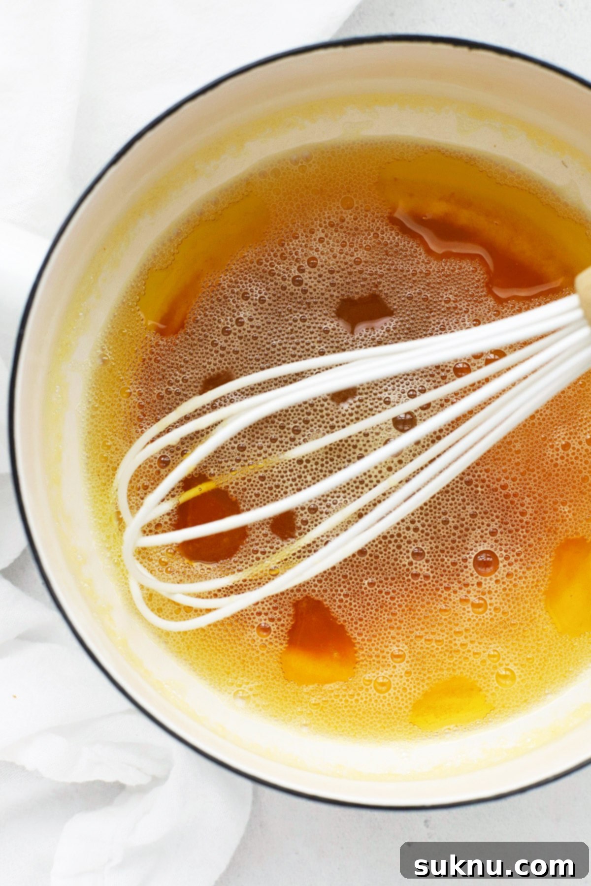How to Make Brown Butter (Easy Step-By-Step Tutorial) - Golden brown butter in a saucepan