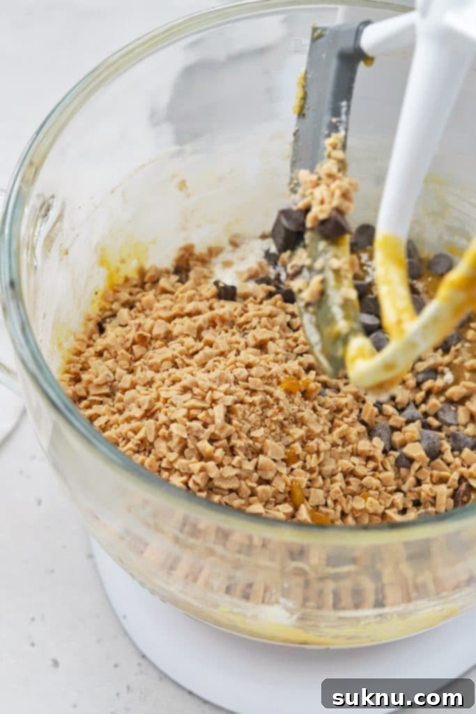 Front view of a stand mixer with cookie ingredients ready for mixing