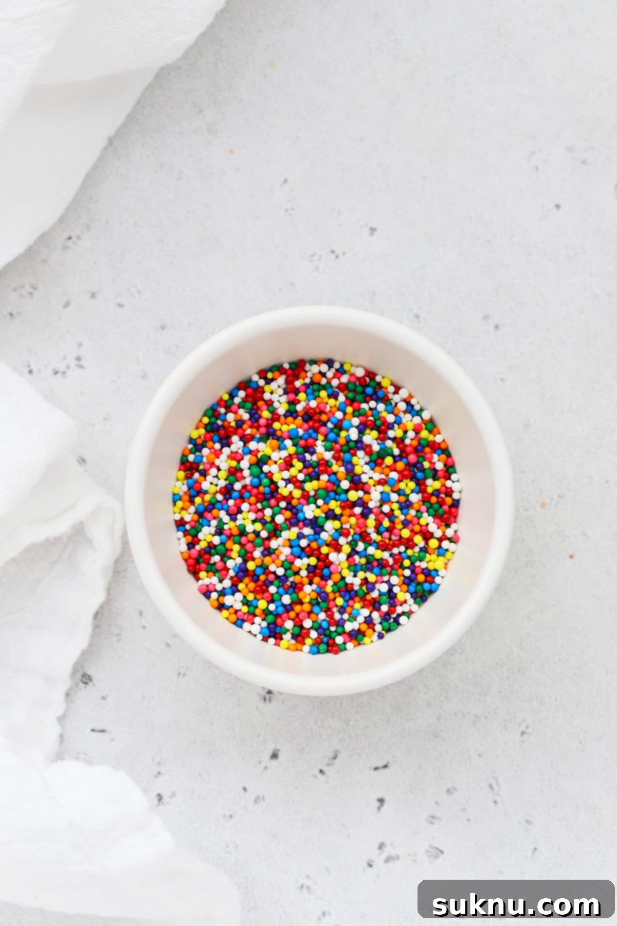 Colorful nonpareils sprinkles sprinkles in a white bowl