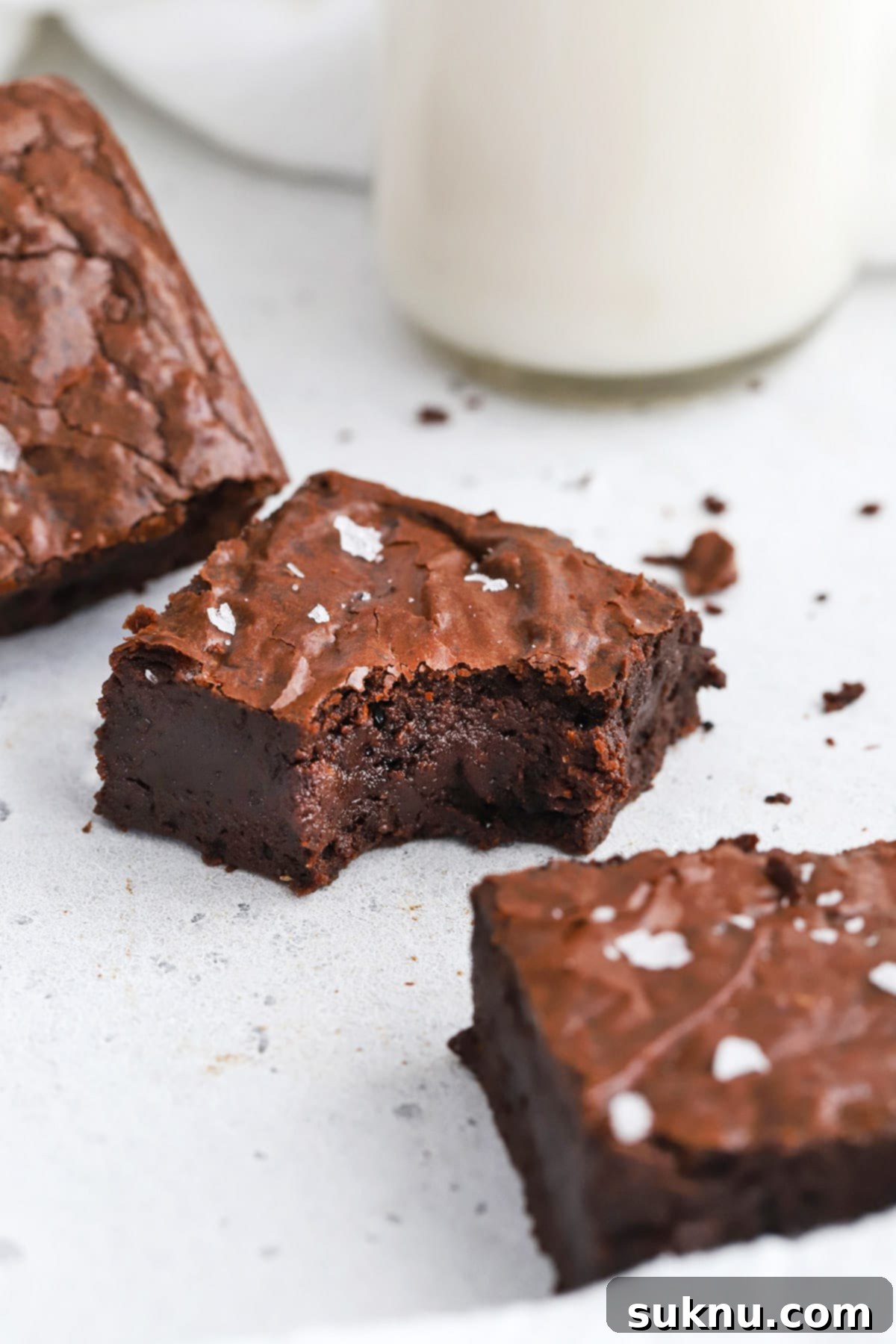 Fudgy Golden Brown Butter Gluten-Free Brownies 3 Close up front view of perfectly fudgy gluten-free brown butter brownies cut in squares, showcasing their rich color and texture.