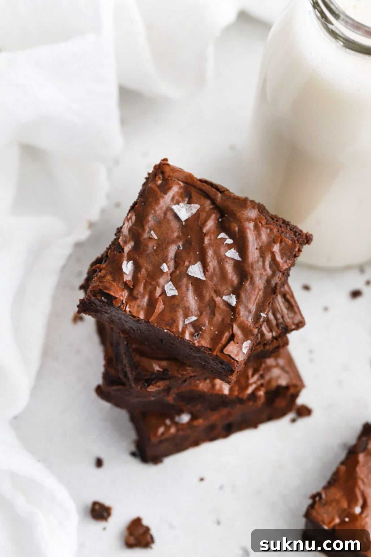 Fudgy Golden Brown Butter Gluten-Free Brownies 8 Front view of a stack of rich, fudgy gluten-free brown butter brownies, inviting you to take a bite.
