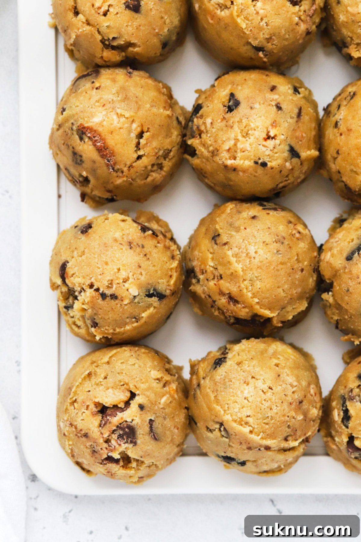 Freeze Cookie Dough Bake Fresh Cookies Anytime 6 Overhead view of gluten-free brown butter chocolate chip cookie dough scooped into balls arranged neatly in rows