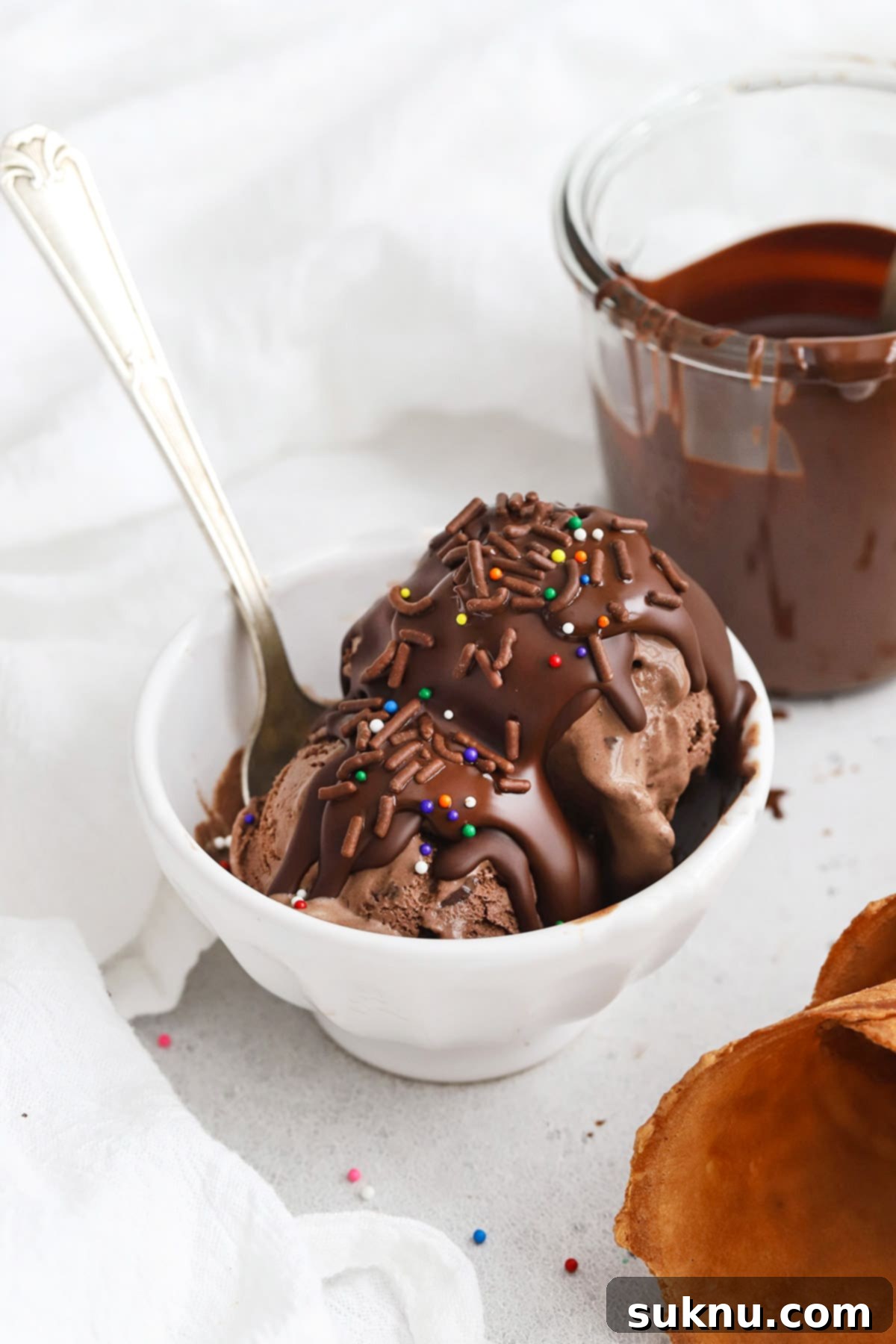 Transform Your Ice Cream: 2-Ingredient Magic Chocolate Shell 2 Homemade 2 ingredient magic chocolate shell on chocolate ice cream, topped with colorful sprinkles