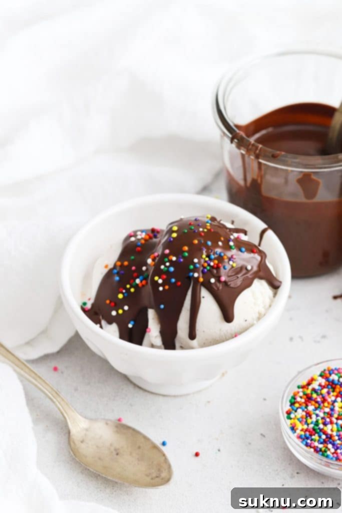 Transform Your Ice Cream: 2-Ingredient Magic Chocolate Shell 6 Homemade magic chocolate shell hardening on vanilla ice cream, showing the transformation from liquid to solid