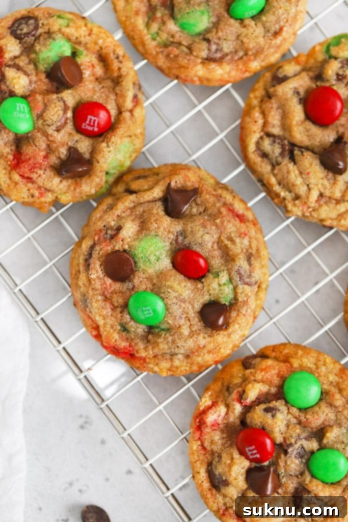 Delicious gluten-free M&M chocolate chip cookies arranged on a plate, freshly baked and ready to be enjoyed.