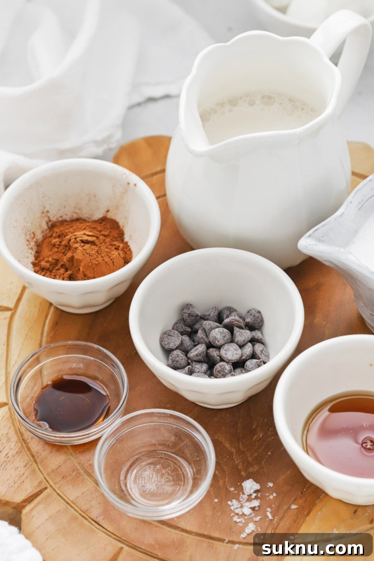 Peppermint Dream Vegan Cocoa 3 A vibrant flat lay showcasing all the fresh and simple ingredients required for making a delightful vegan peppermint hot chocolate.