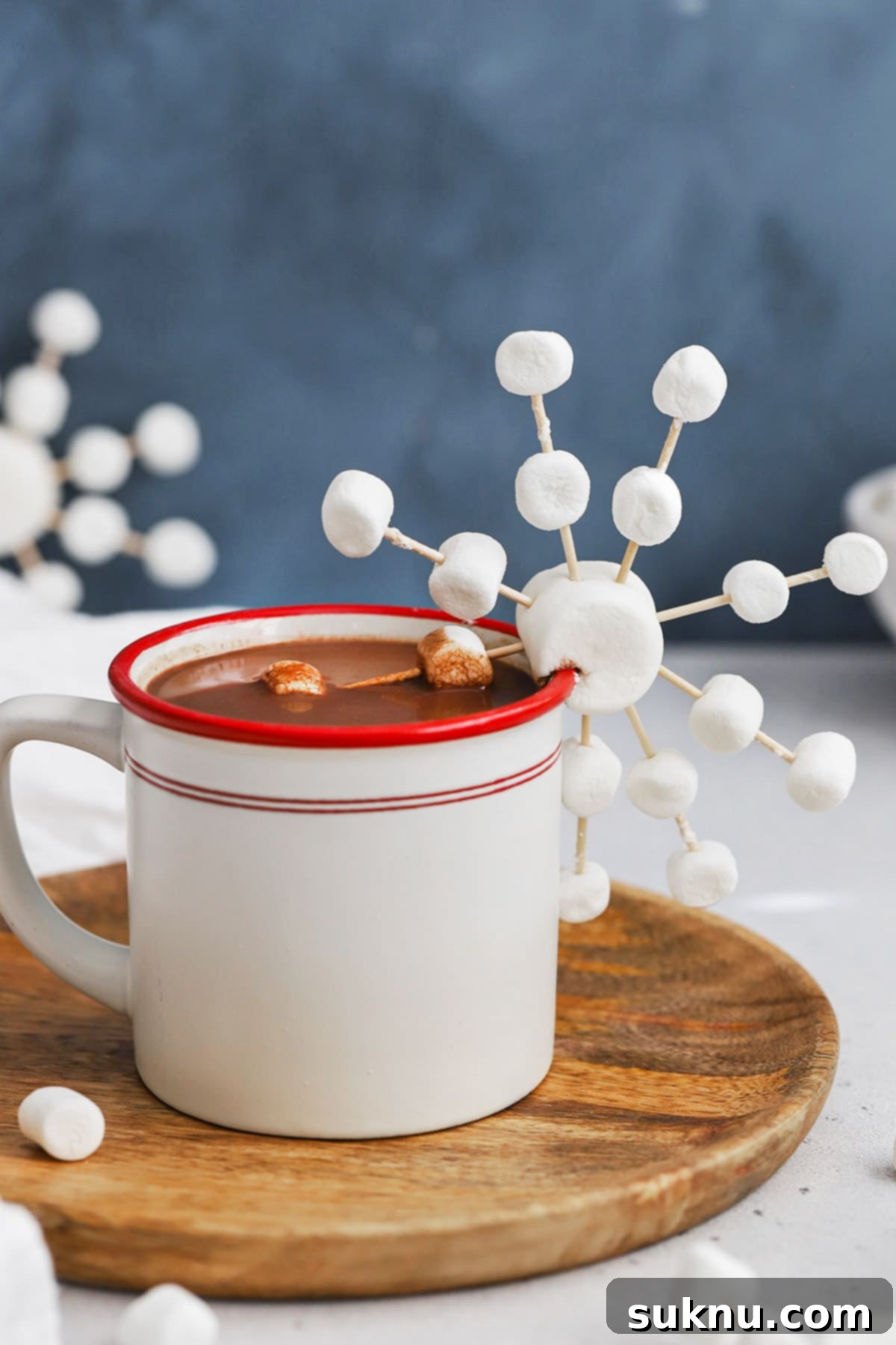 Marshmallow Snowflake Magic 11 Front view of a beautifully crafted marshmallow snowflake resting on a mug of peppermint hot chocolate, perfect for winter decorations or treats.