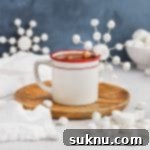 Marshmallow Snowflake Magic 15 Front view of marshmallow snowflakes made out of marshmallows and toothpicks on a mug of peppermint hot chocolate from Sweets & Thank You