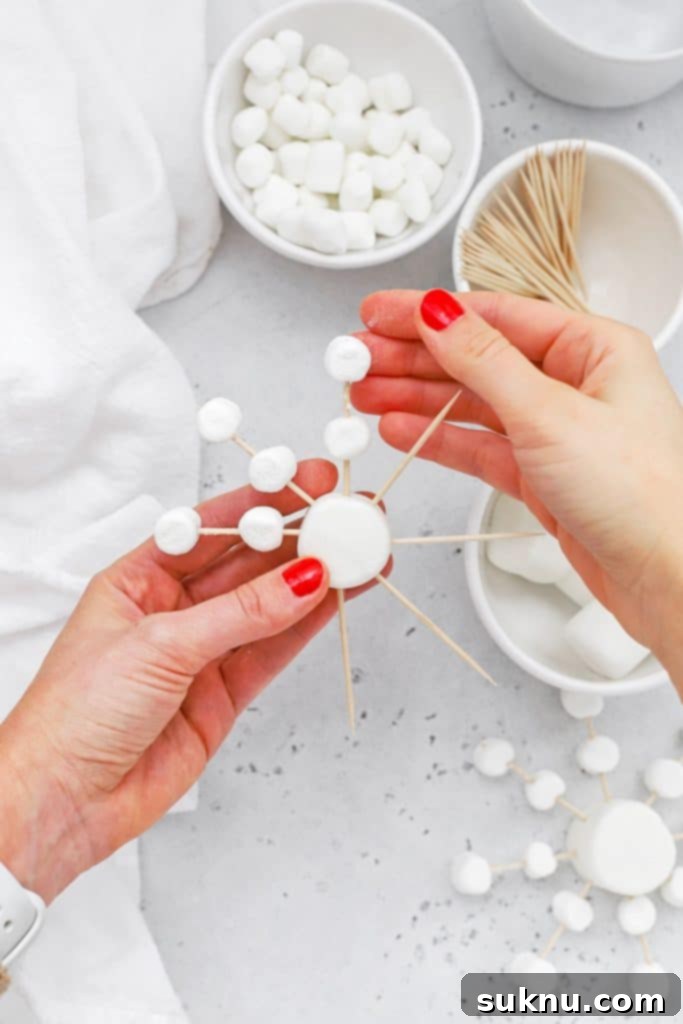 Marshmallow Snowflake Magic 9 Marshmallow snowflake partially completed, highlighting the symmetrical design.