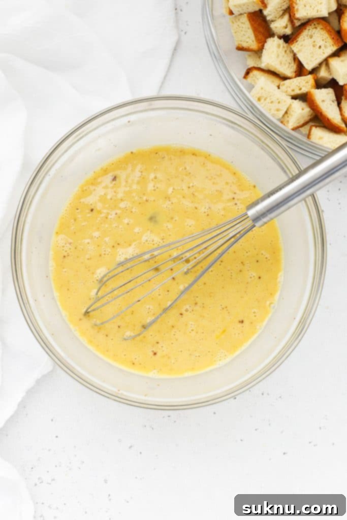 Holiday Gluten Free Eggnog French Toast Bake 5 A whisked bowl of eggnog custard, smooth and creamy, for the gluten-free eggnog french toast casserole