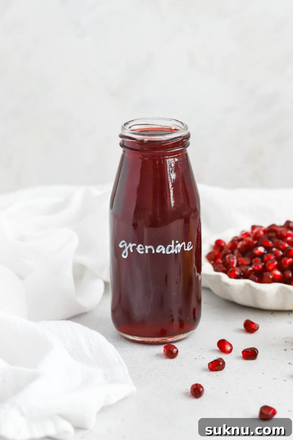 Easy Homemade Grenadine Three Ingredients 2 Homemade Grenadine Syrup in a jar, showcasing its vibrant red color
